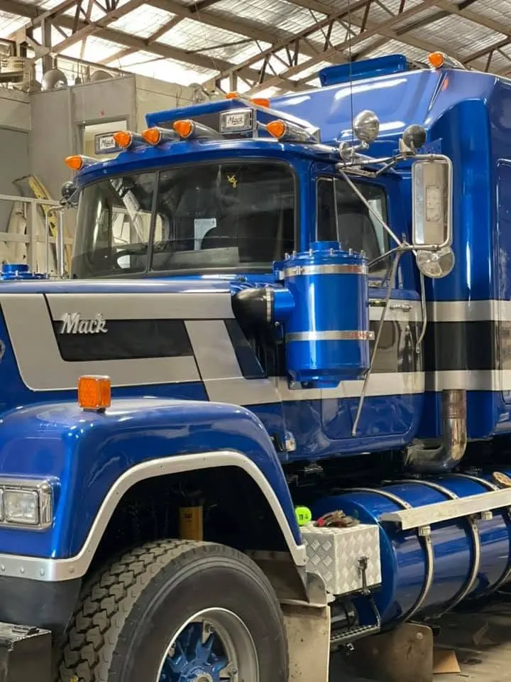 Truck windscreen being replaced at a loading dock after hours